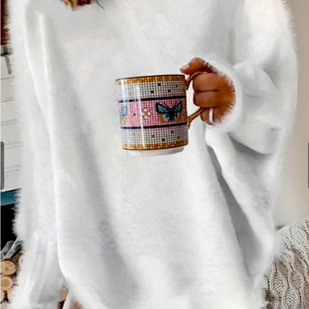 Fuzzy white sweater. Size medium.